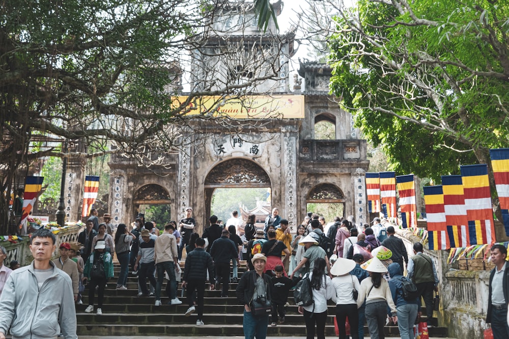 a group of people walking up some steps