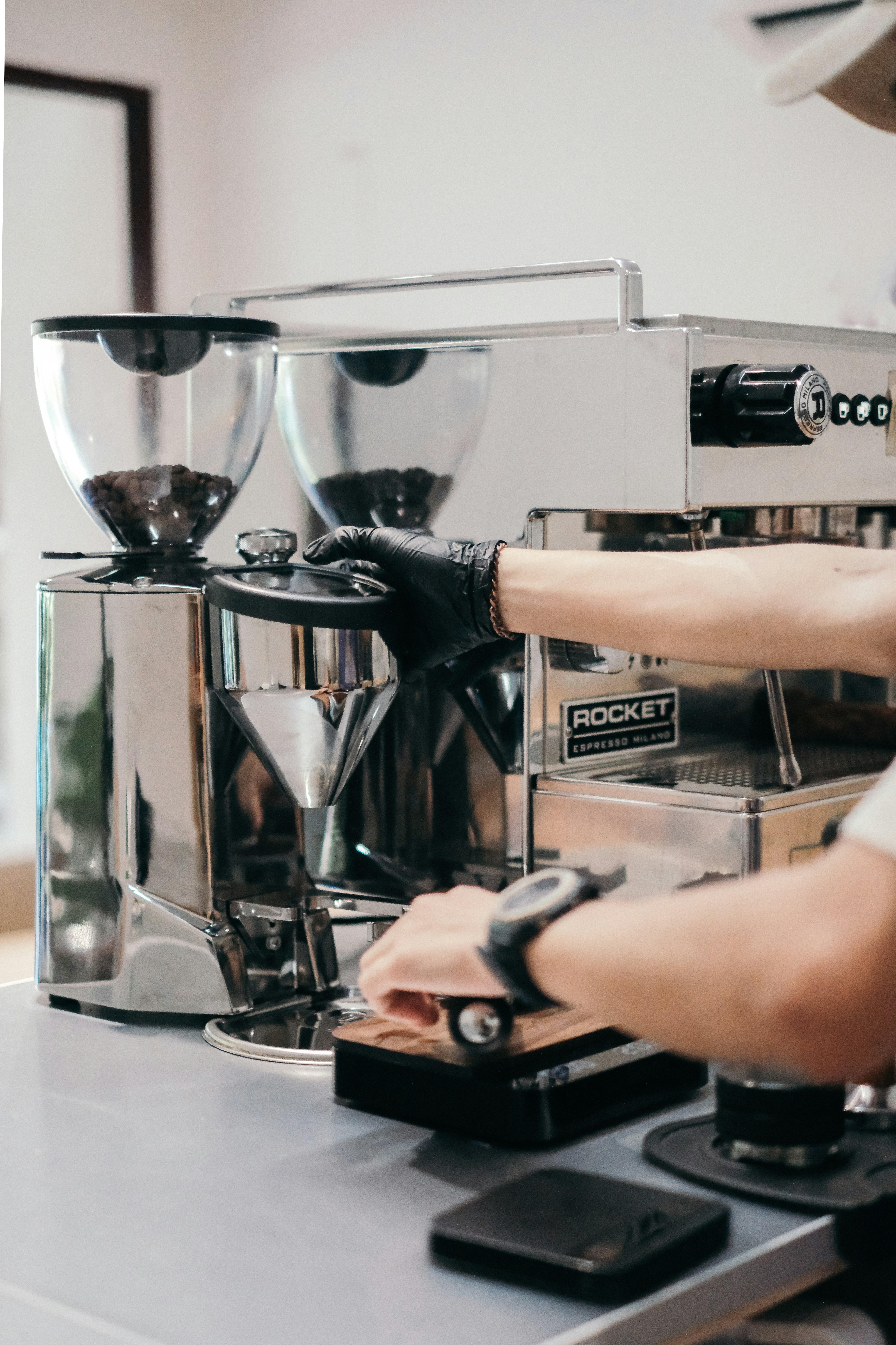 Barista using a modern digital coffee machine