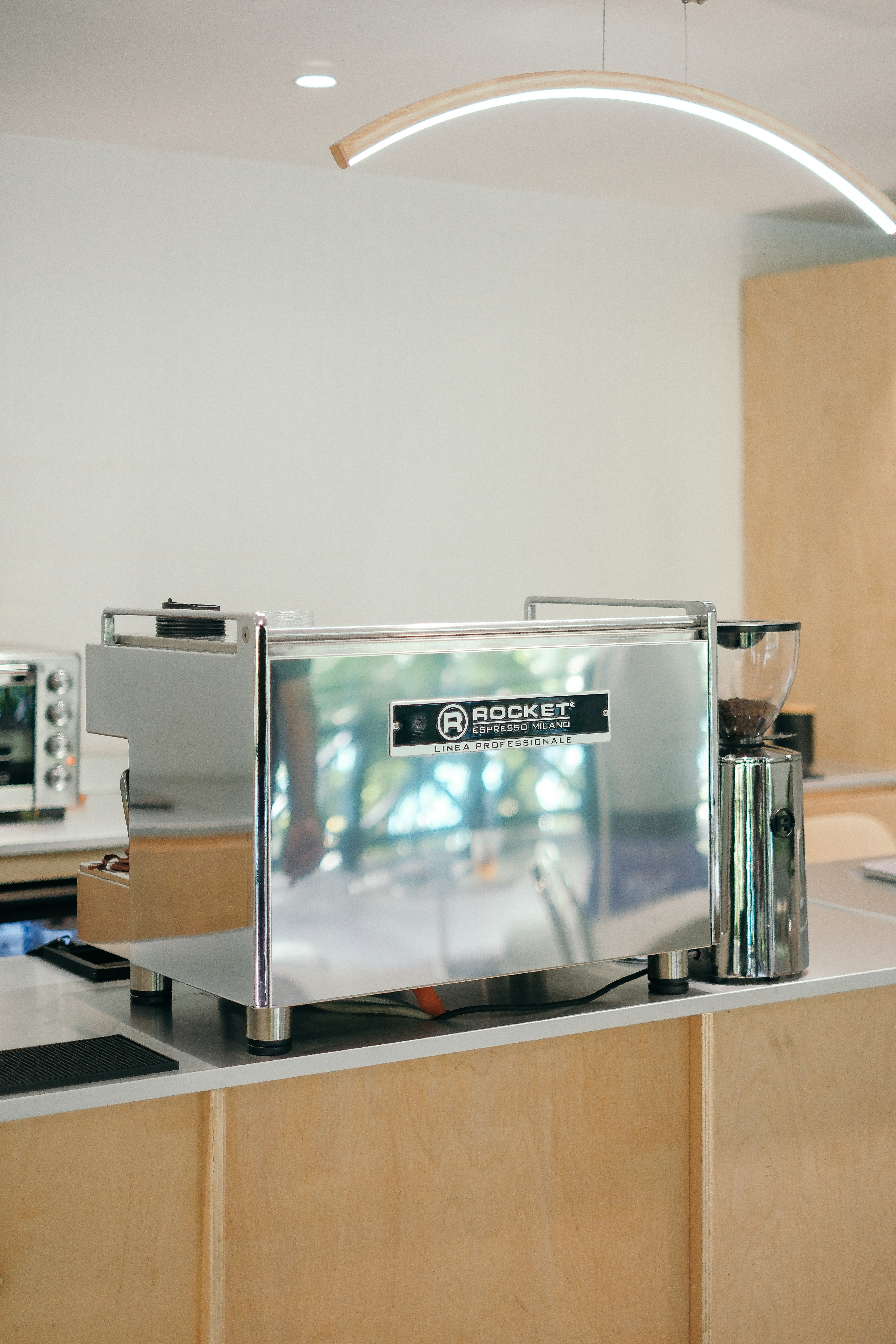 a silver toaster sitting on top of a counter
