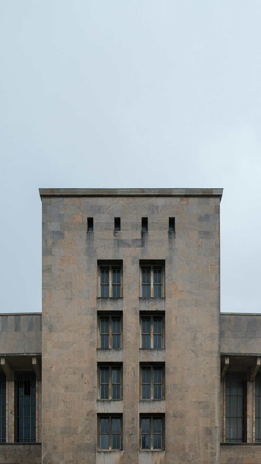 a large building with a clock on the front of it