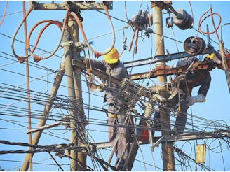 a man working on an electrical pole