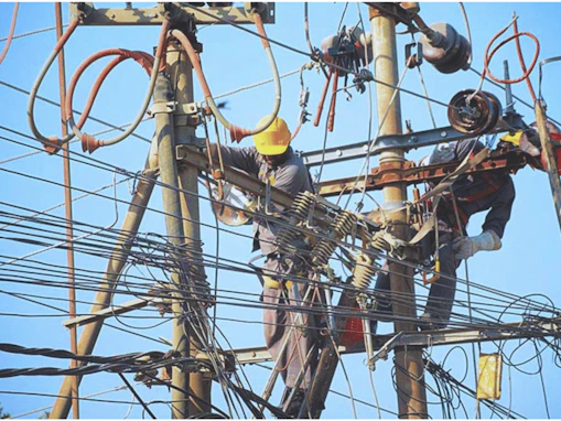 a man working on an electrical pole