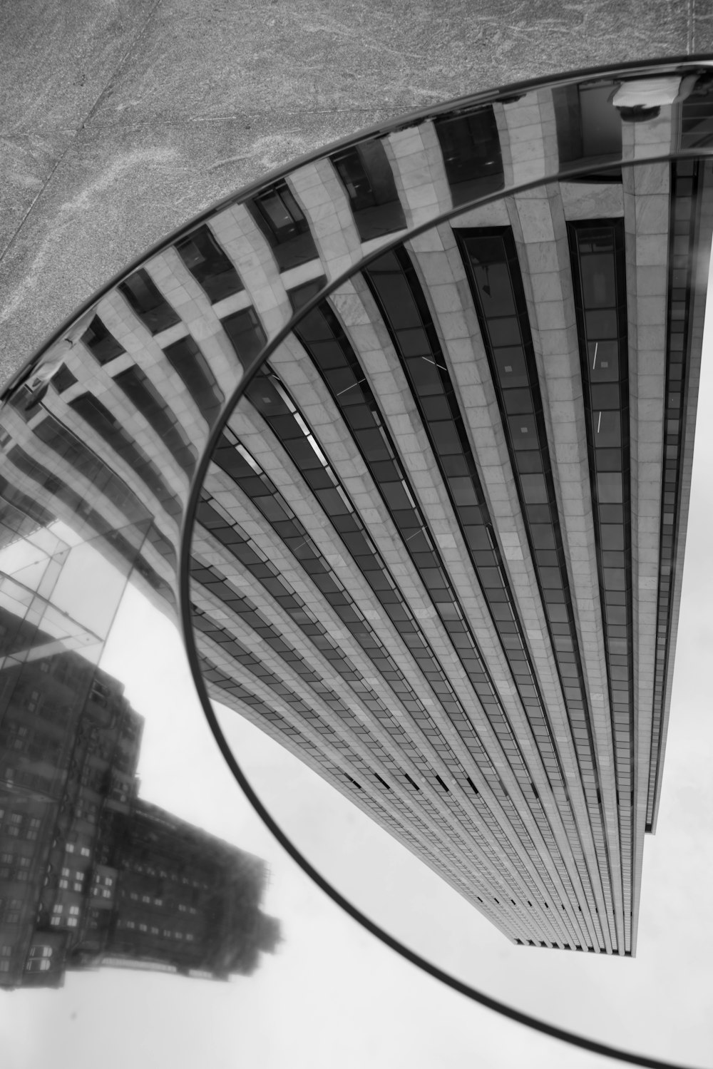 a reflection of a building in a mirror