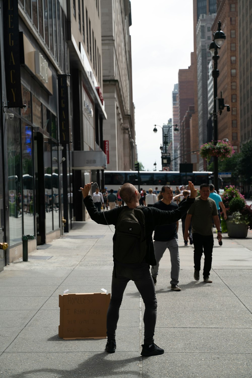 a man standing in the middle of a city street