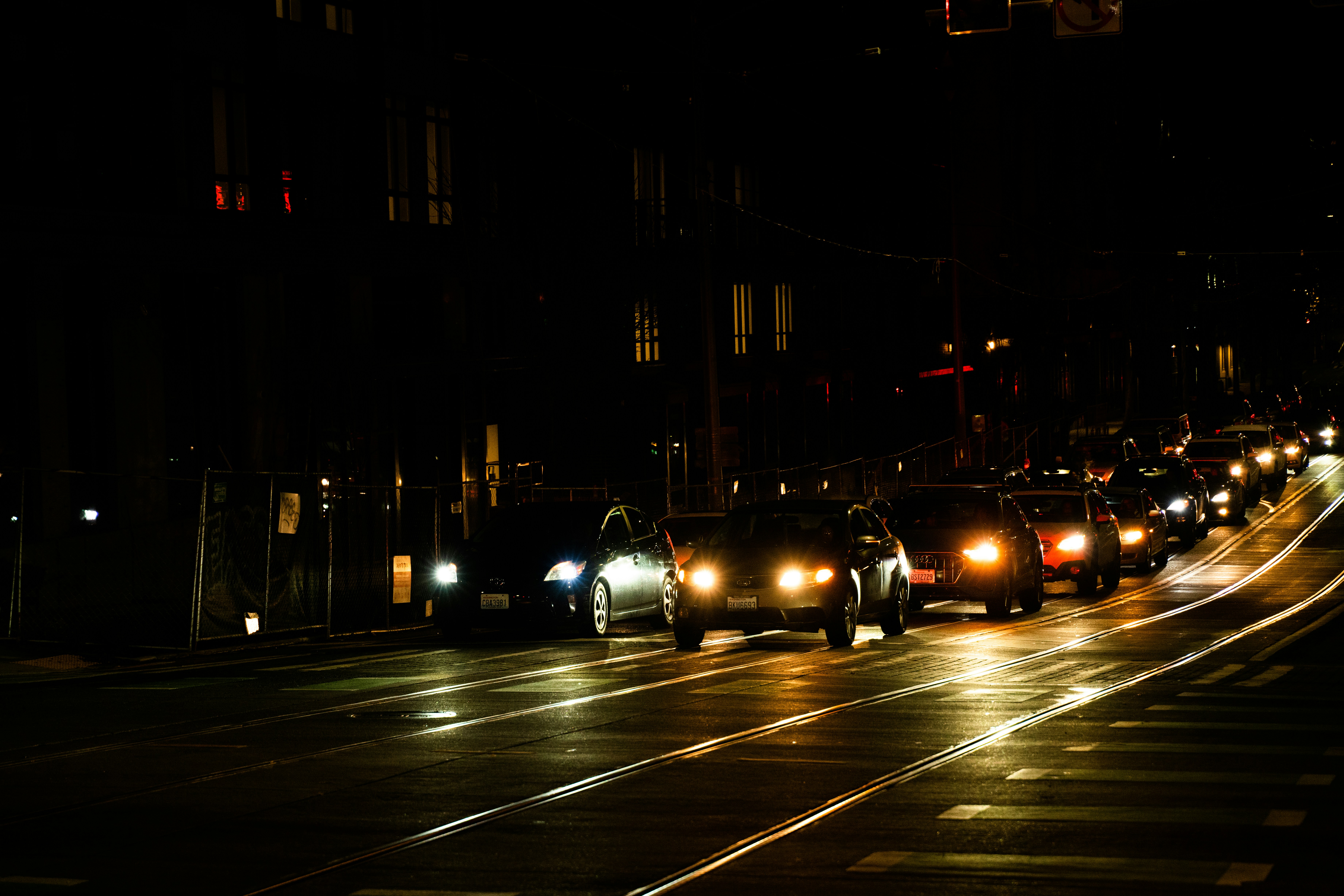 Electric car slowing in city traffic, illustrating regenerative braking in stop-and-go conditions