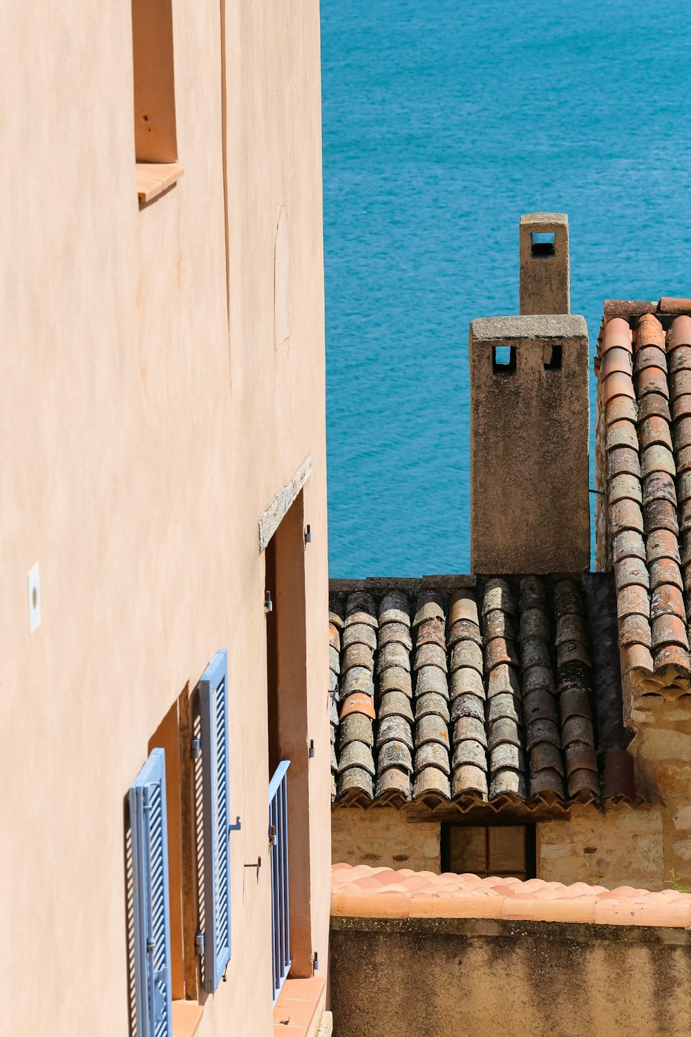 a view of the ocean from a rooftop of a building