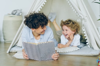a woman reading a book to a child