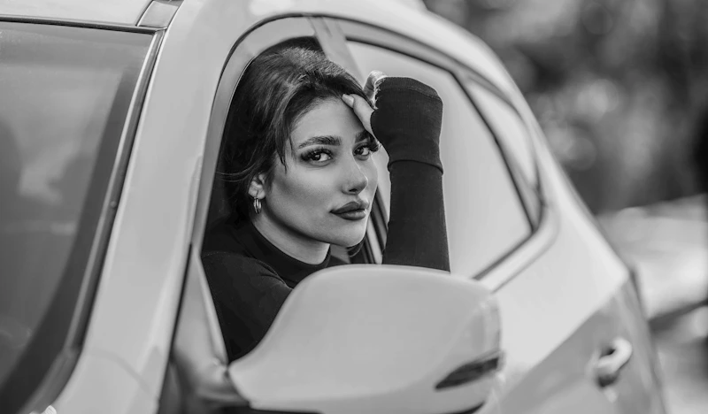 Elegant sugar baby enjoying a luxurious car ride in Canada