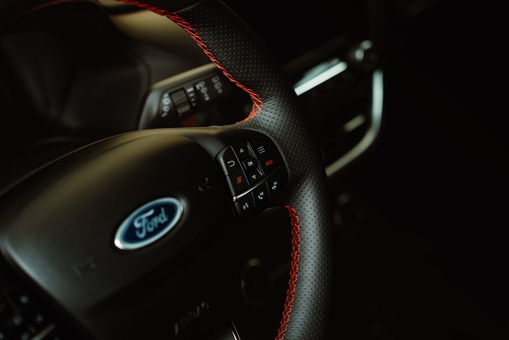 a close up of a steering wheel in a car