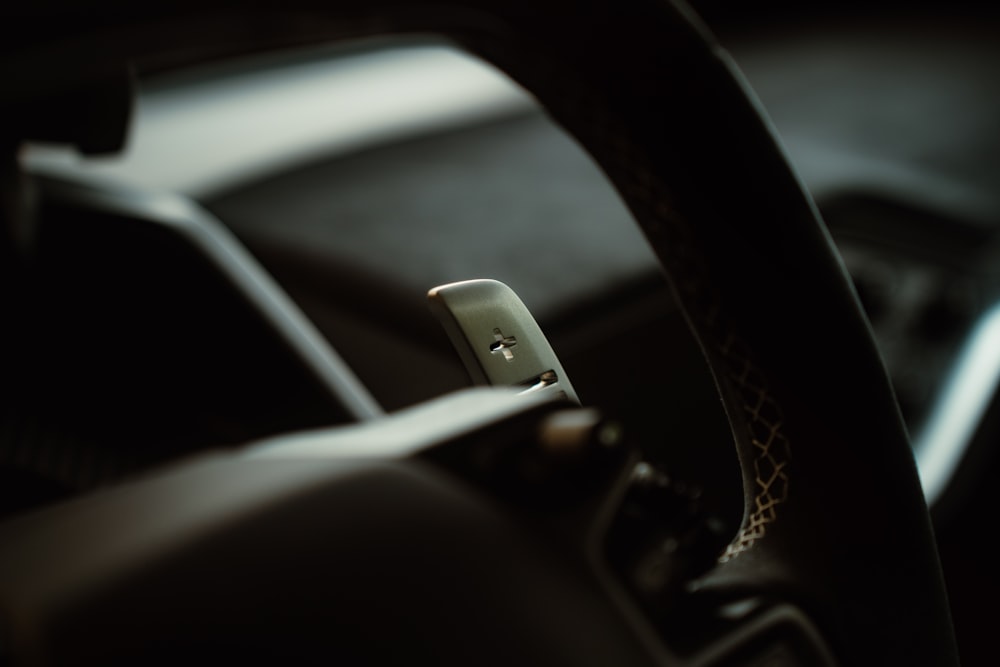 a close up of a cell phone in a car