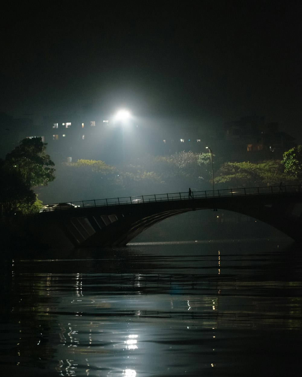 a bridge over a body of water at night