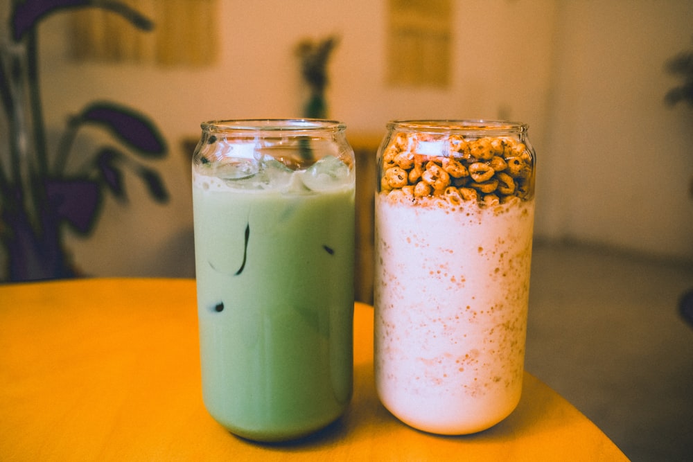 a couple of jars sitting on top of a table