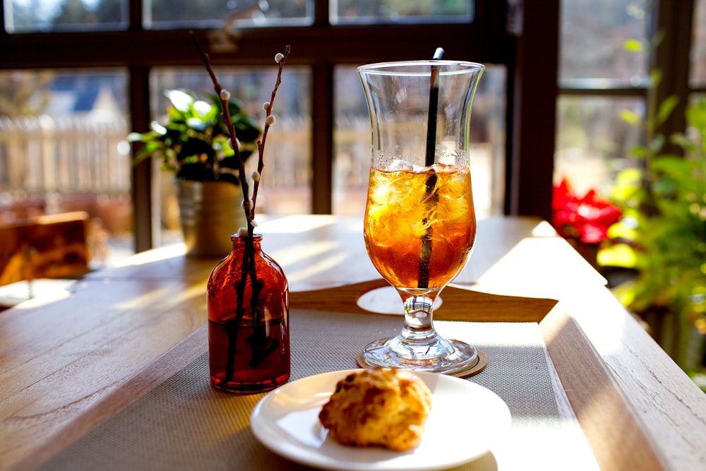 a plate of food and a drink on a table