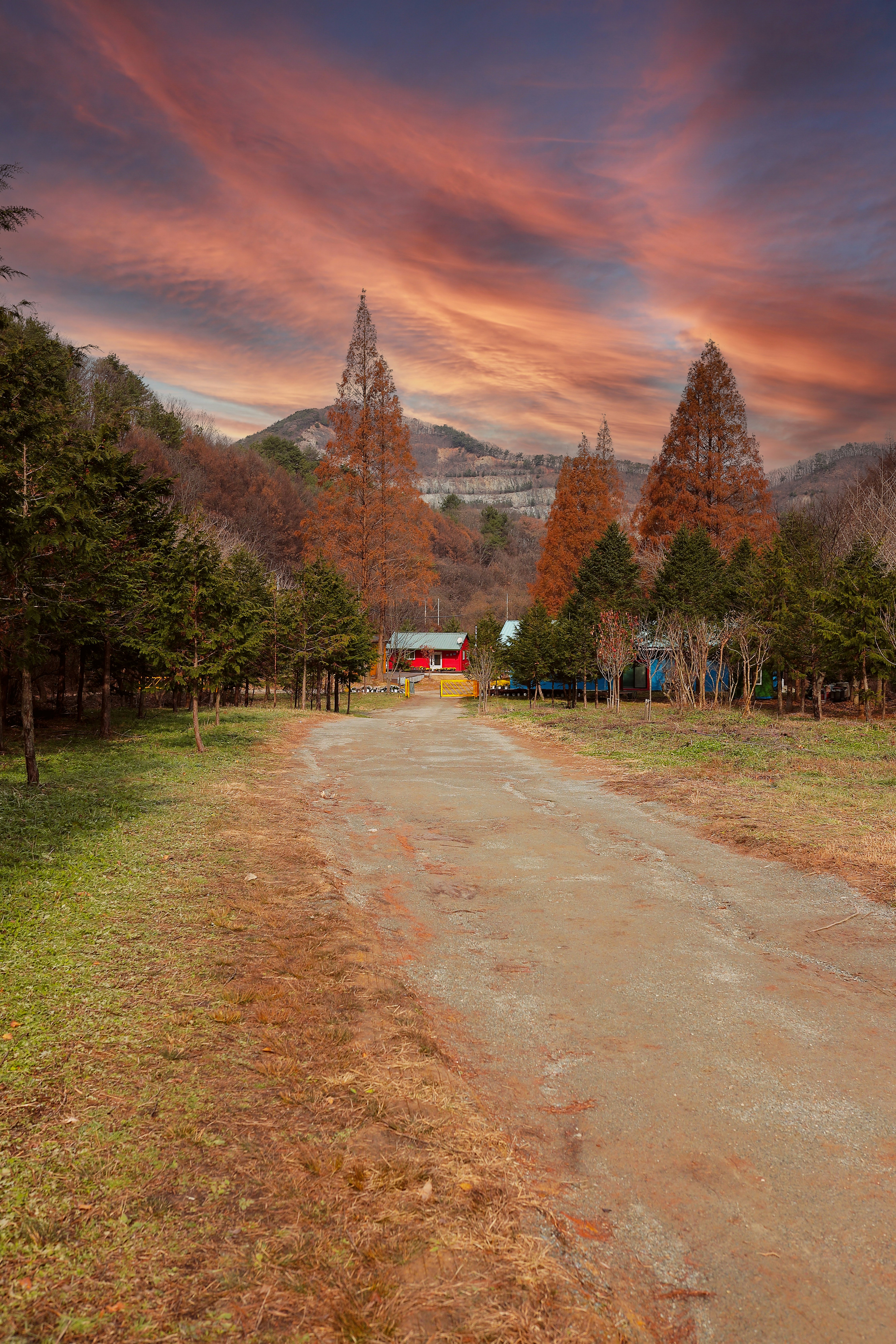 A dirt road with a red barn in the distance photo – Free Korea Image on ...