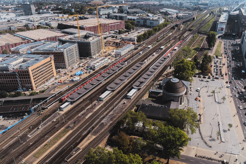 an aerial view of a train track and a city