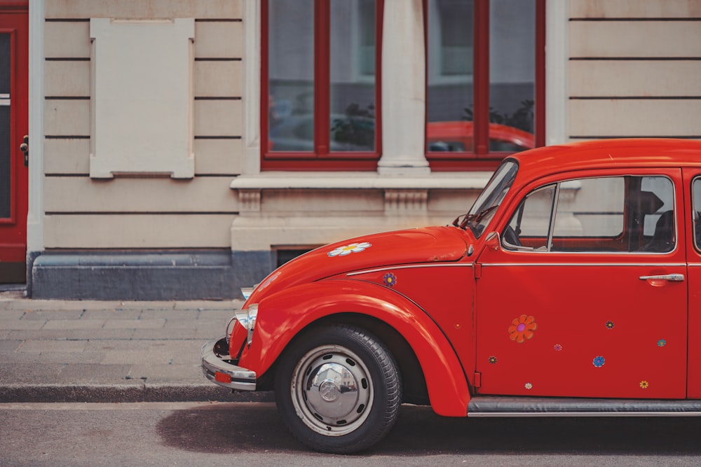 a red car parked on the side of the road