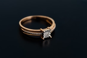 a close up of a ring on a black surface