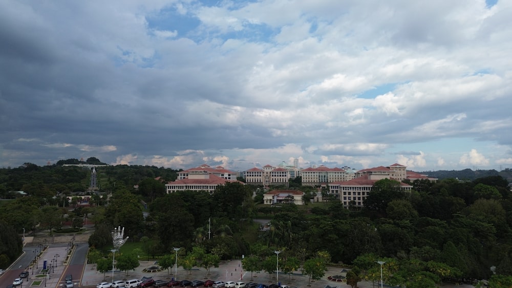 a city with a lot of cars parked in front of it