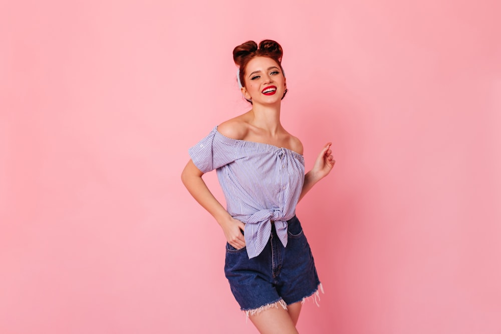 a woman posing for a picture with her hands on her hips