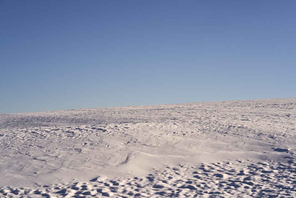 a person on a snowboard in the snow