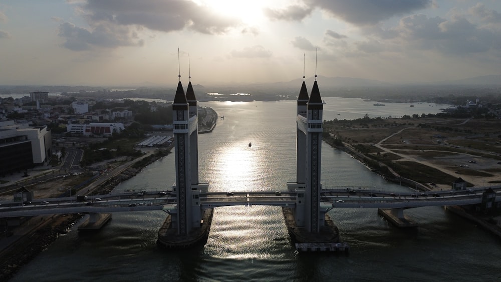 an aerial view of a bridge over a body of water