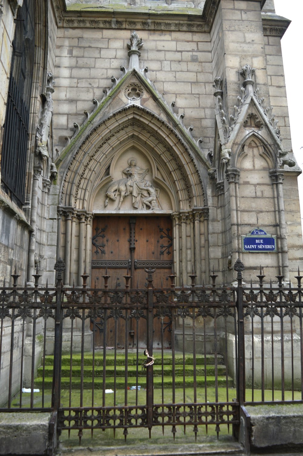 an old church with a gate in front of it