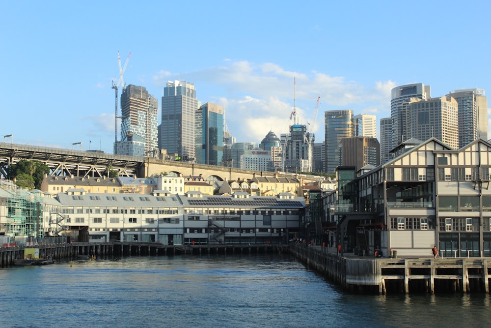 a large body of water with a city in the background