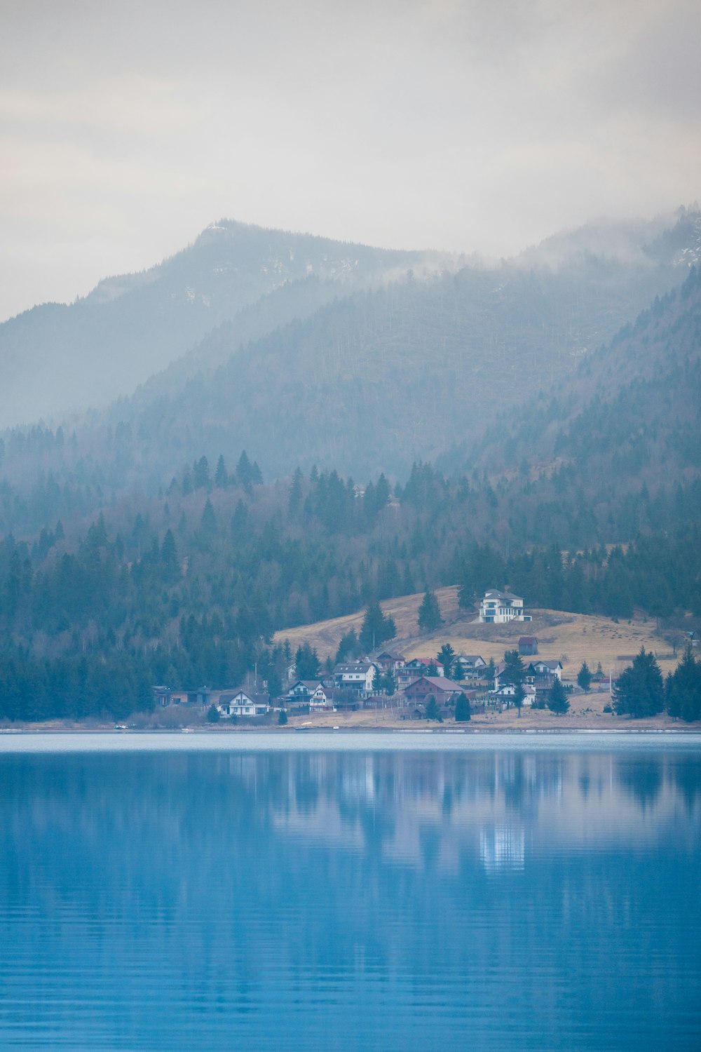 a body of water with a mountain in the background