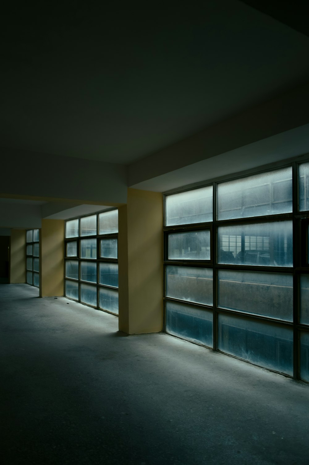 an empty room with a lot of windows