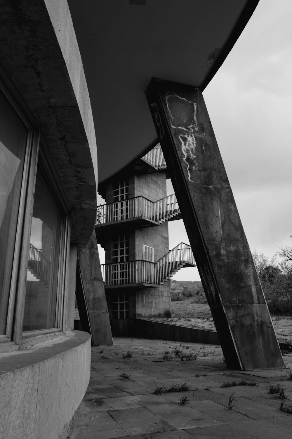 a black and white photo of an abandoned building