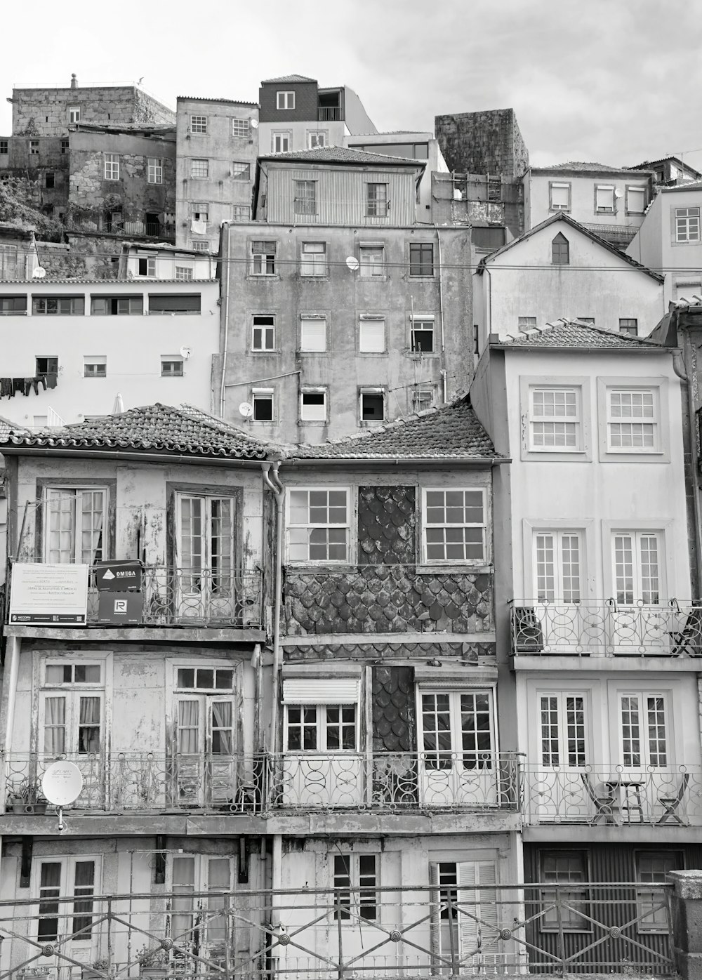 a black and white photo of a bunch of buildings