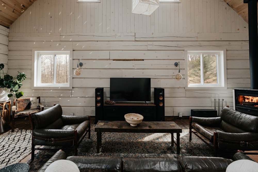 a living room filled with furniture and a fire place