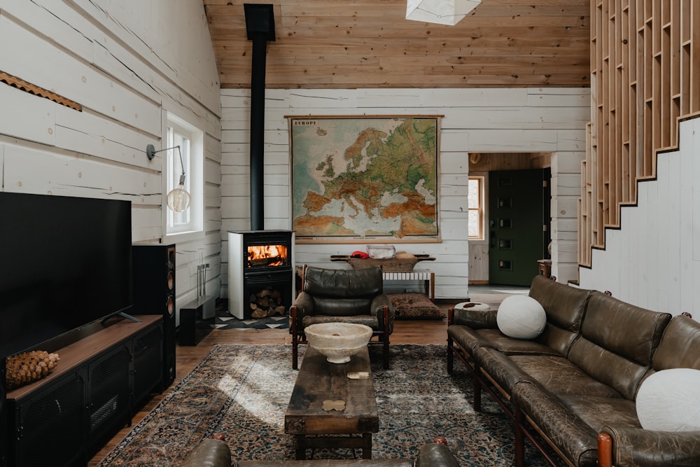 a living room filled with furniture and a fire place