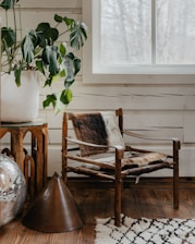 a chair and a potted plant in a room