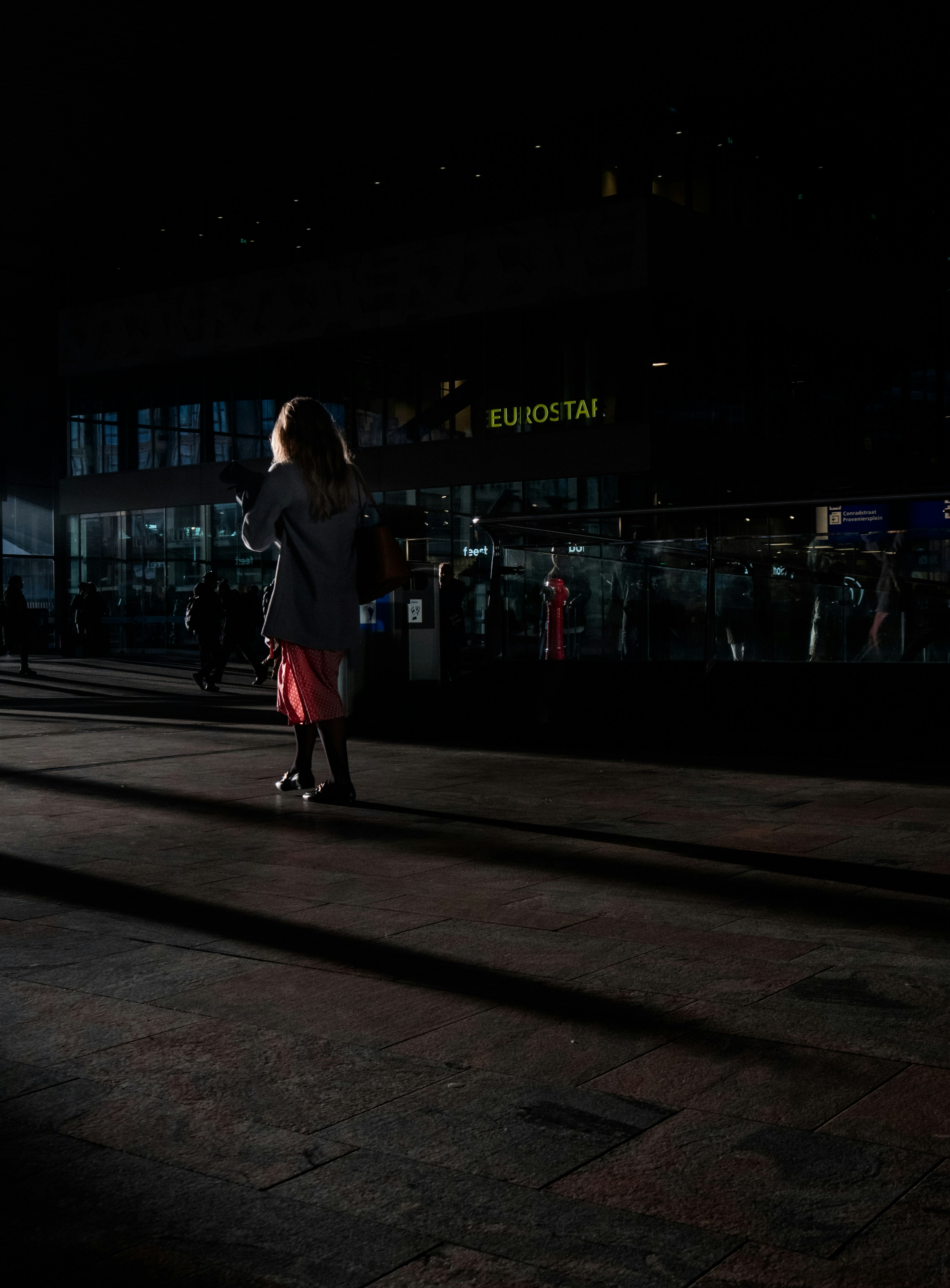 a person riding a skateboard at night