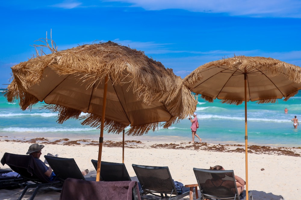 a couple of umbrellas that are on a beach