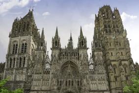 a large cathedral with a clock on the front of it