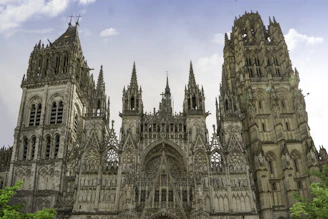 a large cathedral with a clock on the front of it