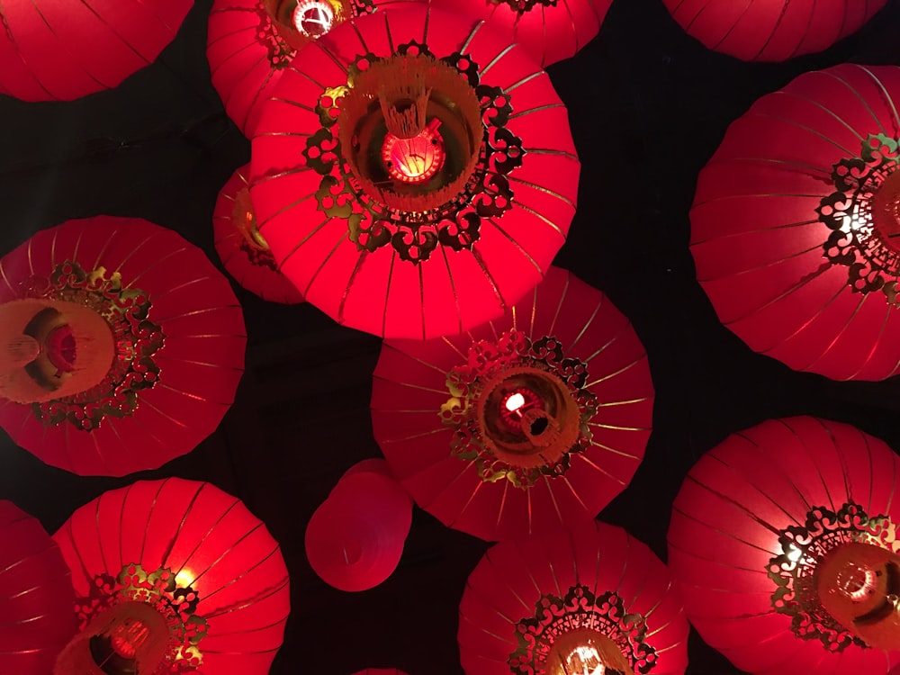 a bunch of red lanterns are lit up