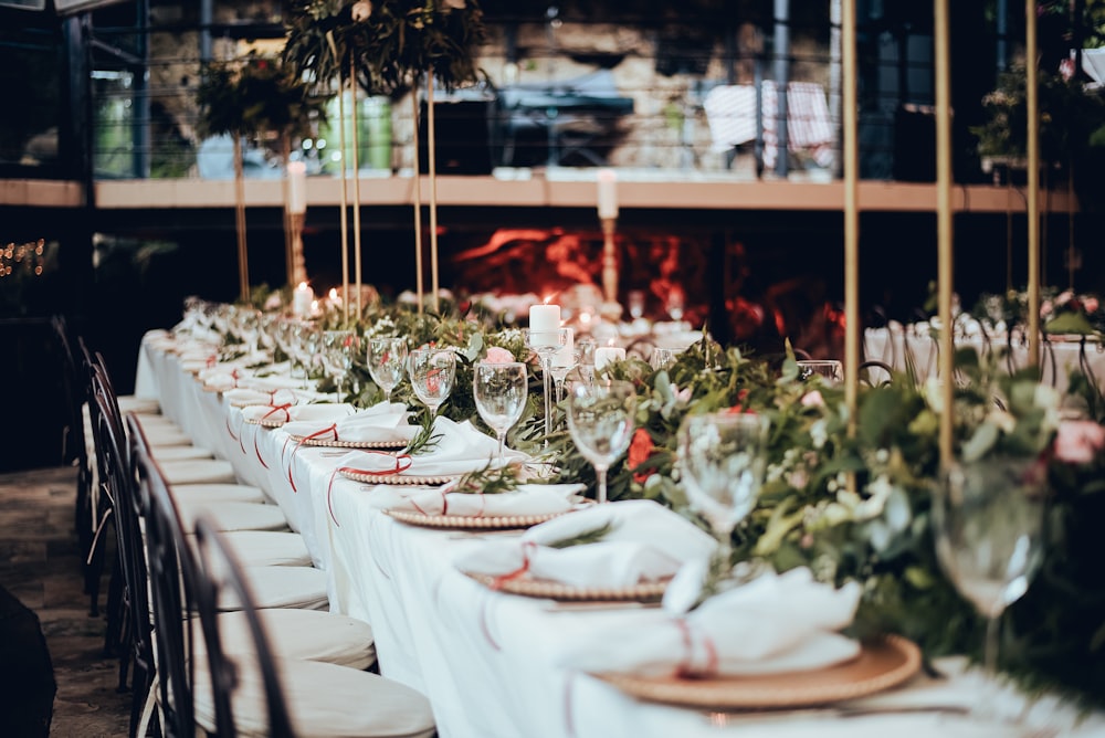 a long table is set for a formal dinner