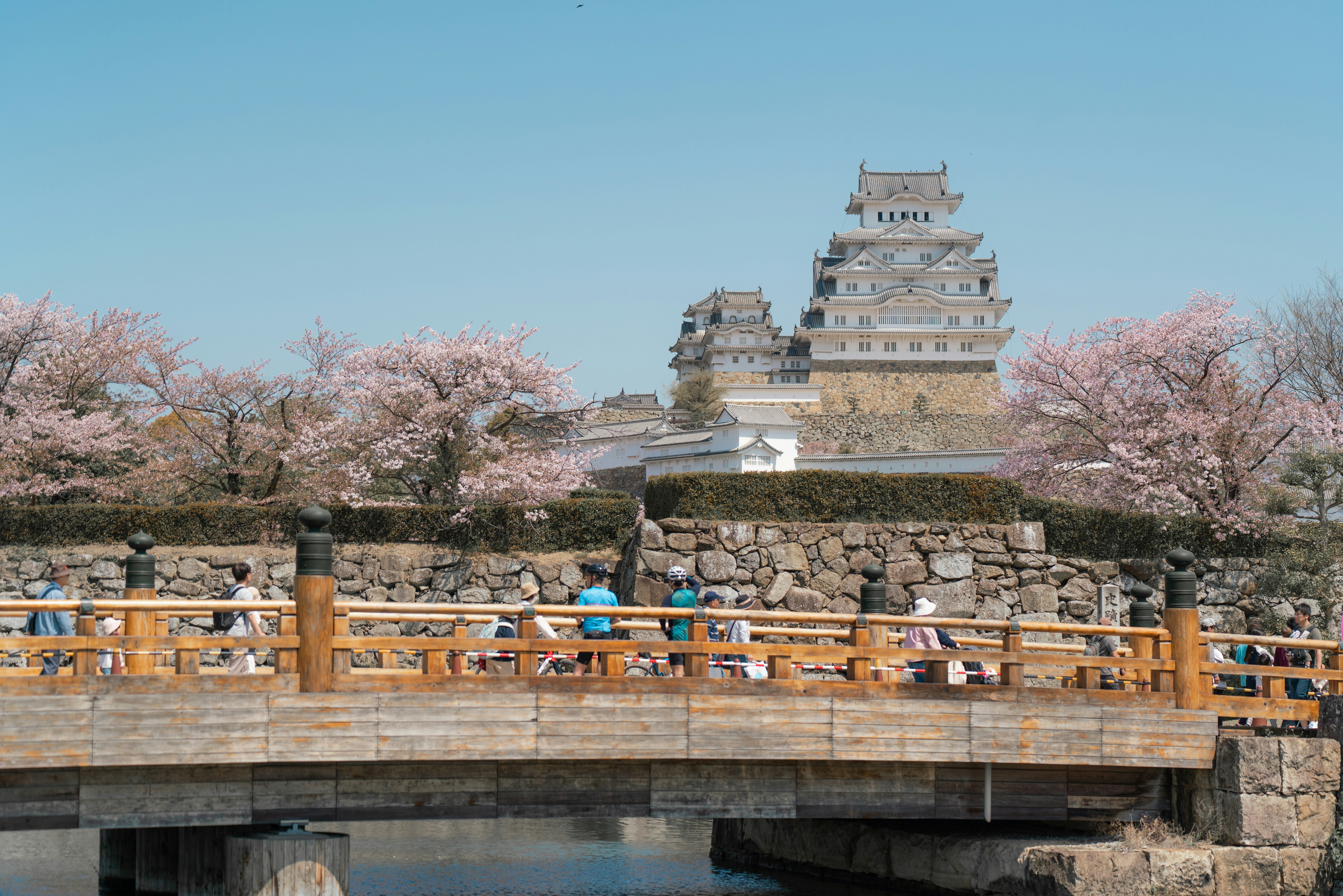 a bridge that has people walking across it