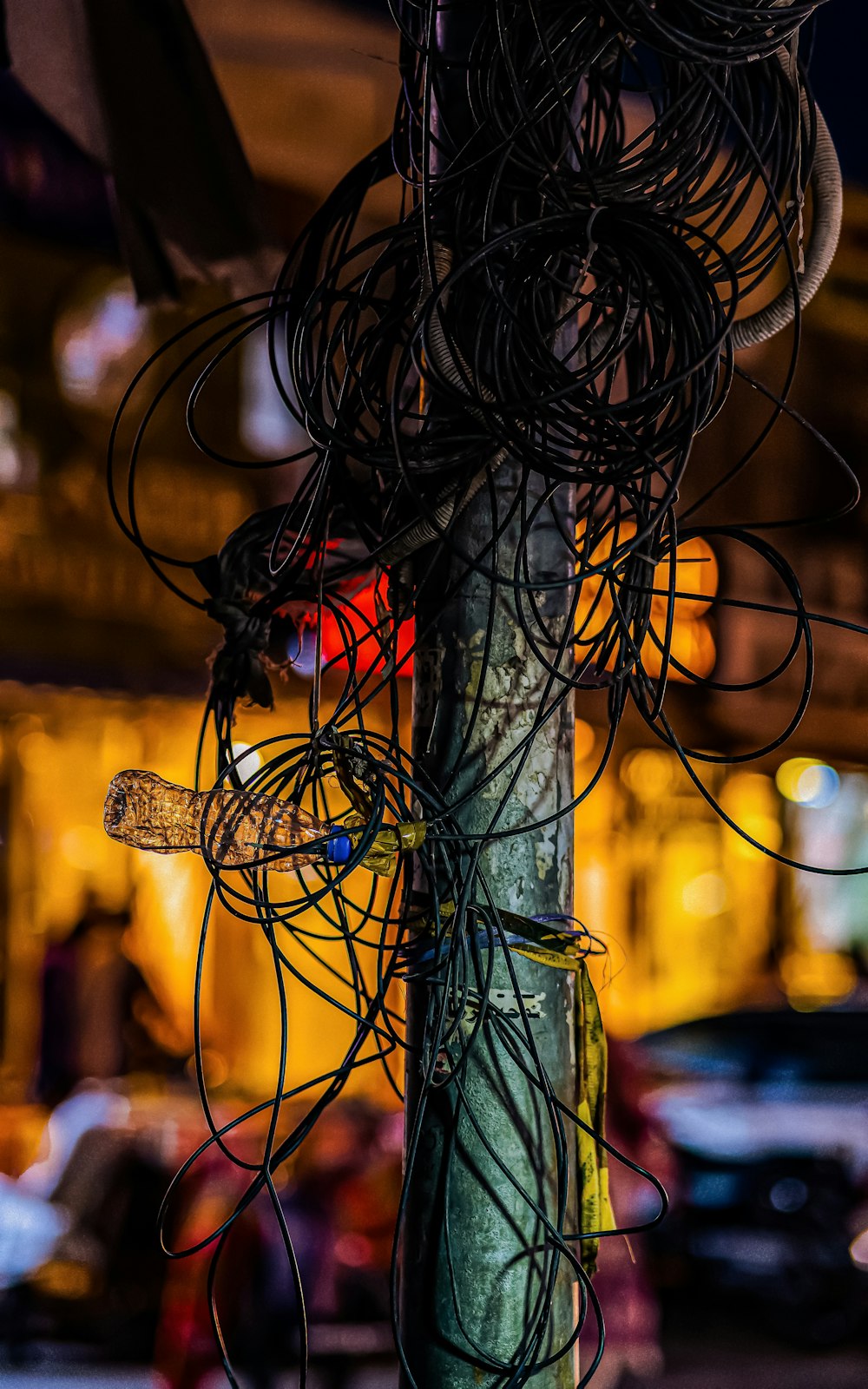 a telephone pole covered in wires and wires
