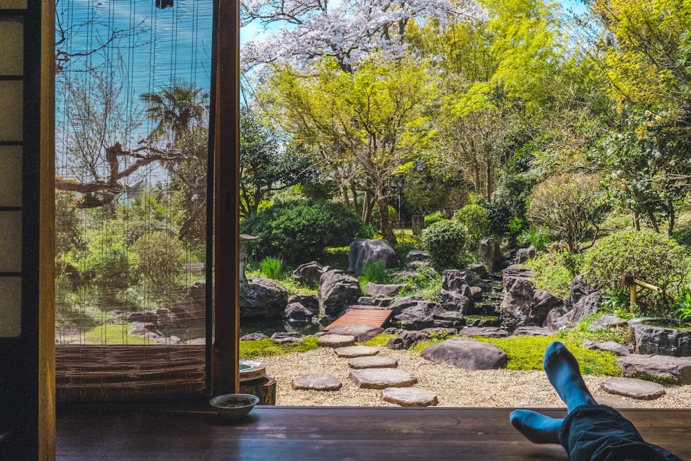 a person laying on the floor in front of a window