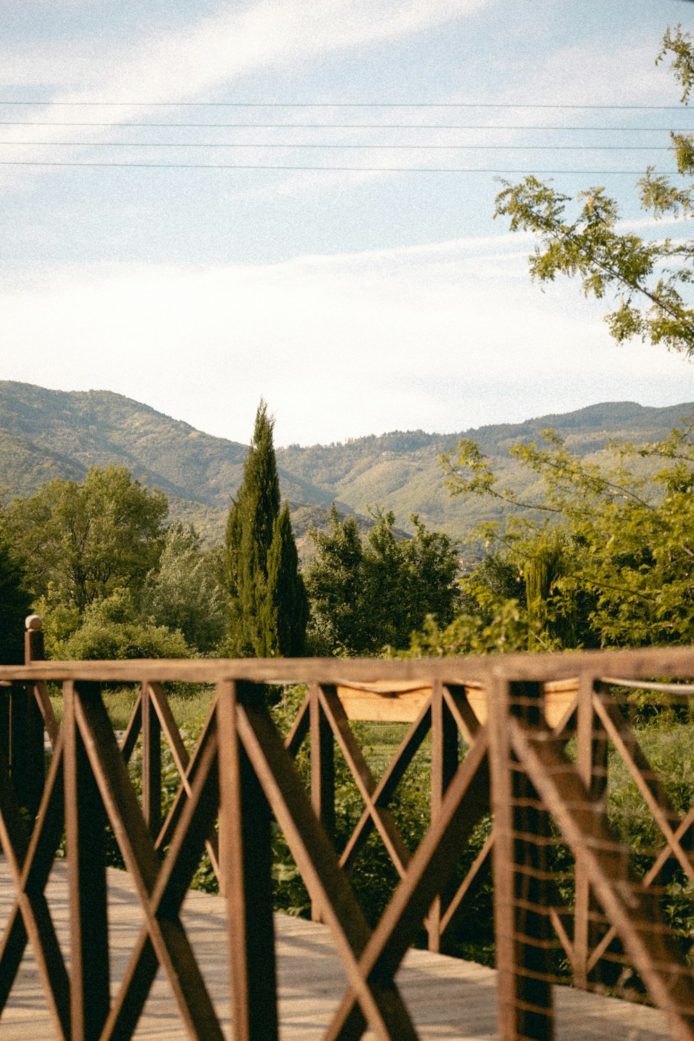 a man riding a skateboard across a wooden bridge