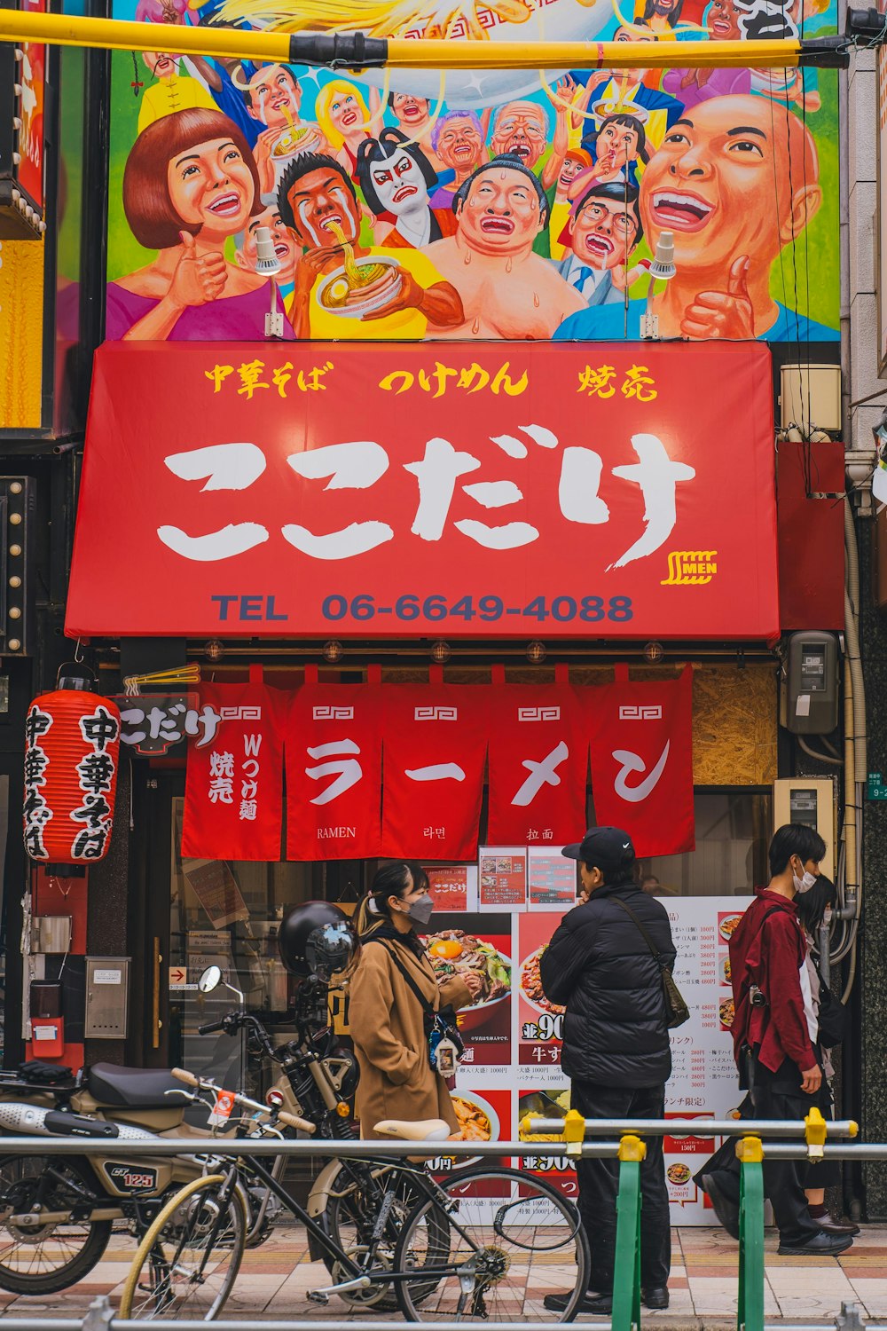 a group of people standing outside of a chinese restaurant