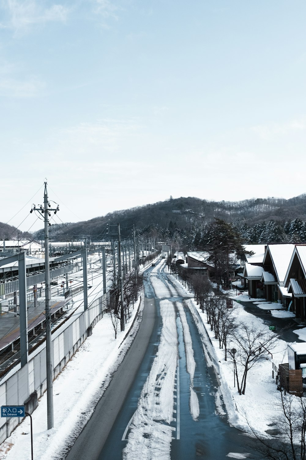 a train traveling down a snow covered train track