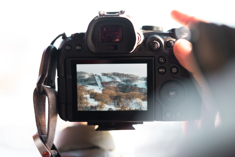 a person holding a camera up to take a picture