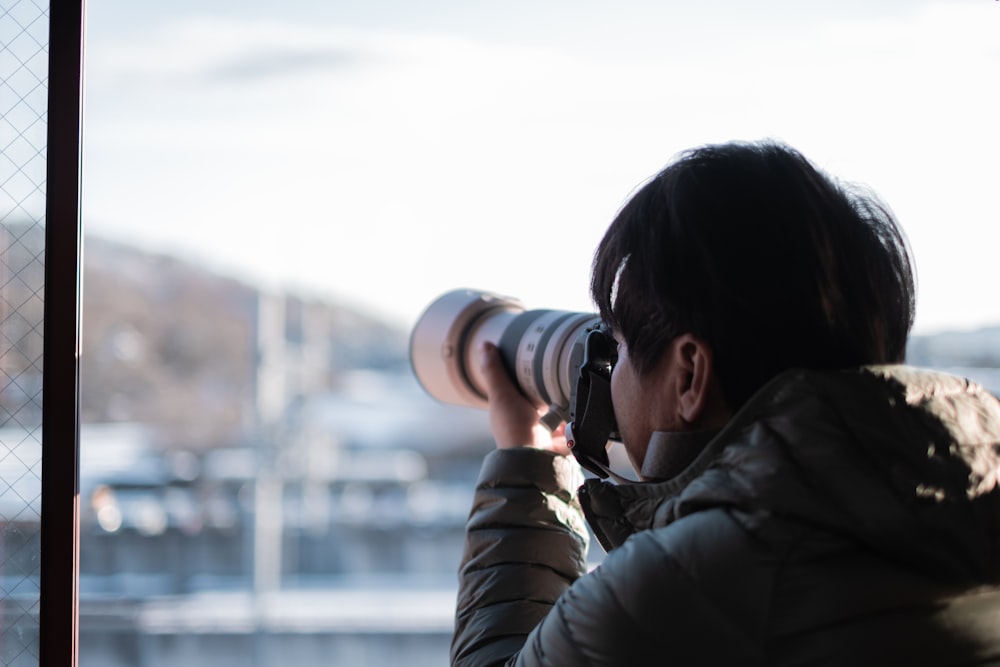 a woman taking a photo with a camera