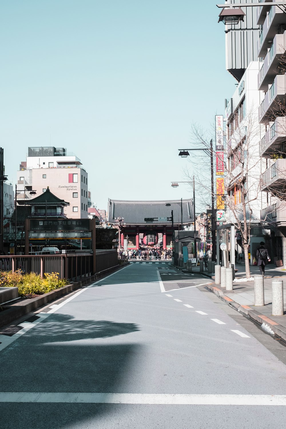 an empty street in a city with tall buildings