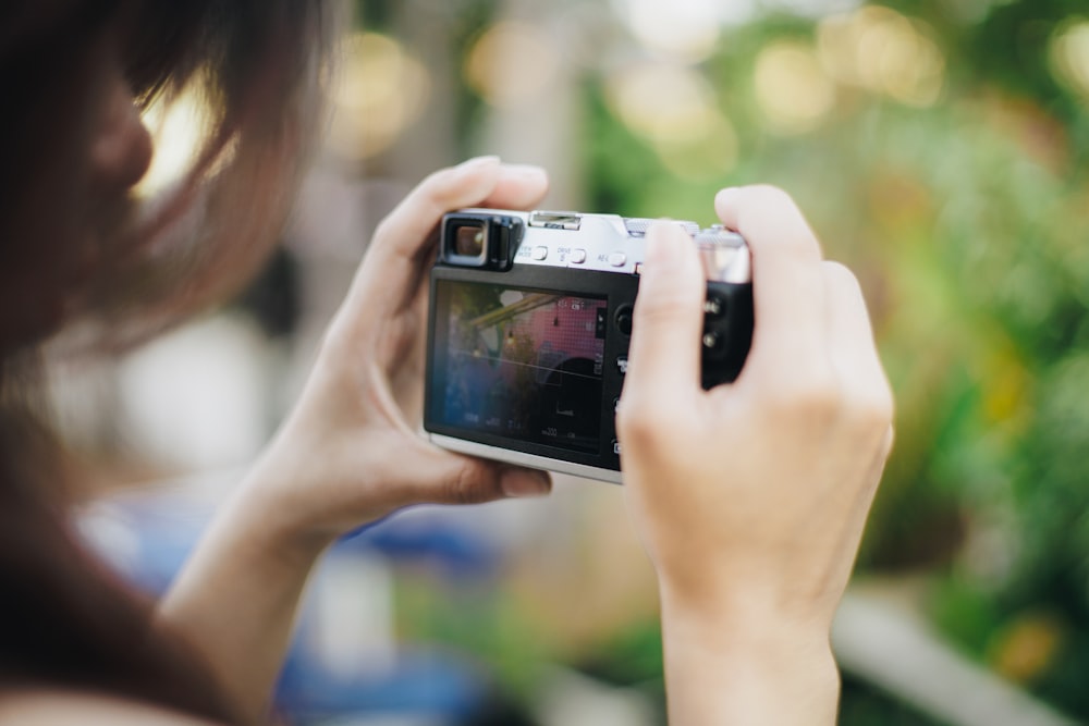 a woman taking a picture with her camera